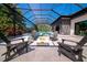 Inviting backyard patio with a modern fire pit and comfortable seating, ideal for outdoor gatherings at 1555 Eastbrook Dr, Sarasota, FL 34231