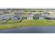 An aerial view of backyards and houses in a lakeside community, showcasing outdoor living and neighborhood appeal at 16161 61St E Ln, Parrish, FL 34219