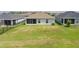 Large grassy backyard with a screened lanai, offering a relaxing outdoor space at 16161 61St E Ln, Parrish, FL 34219