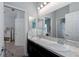 Bright bathroom featuring a double vanity with granite countertops and ample lighting at 16161 61St E Ln, Parrish, FL 34219