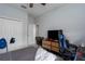 This spacious bedroom boasts carpet floors, a TV, and natural light at 16161 61St E Ln, Parrish, FL 34219