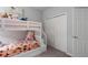 This adorable ' bedroom has a bunkbed, carpet, and a closet at 16161 61St E Ln, Parrish, FL 34219