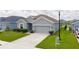 Charming one-story home with a well-manicured lawn and a two-car garage at 16161 61St E Ln, Parrish, FL 34219
