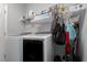 A well-organized laundry room showcases a washer, dryer, and shelving for storage at 16161 61St E Ln, Parrish, FL 34219
