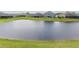 Scenic pond view highlighting the waterfront location of backyard homes in a residential neighborhood at 16161 61St E Ln, Parrish, FL 34219