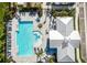 Overhead of a pristine pool and pool house, perfect for relaxation and community gatherings at 16161 61St E Ln, Parrish, FL 34219