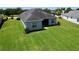 Aerial view of a well-maintained backyard, showcasing the home's landscaping at 16848 Rosedown Gln, Parrish, FL 34219