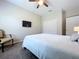 Bright bedroom with a ceiling fan, a queen-sized bed, and a window with a shutter at 16848 Rosedown Gln, Parrish, FL 34219