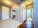 Entryway showcasing tile and wood flooring, coat closet, and access to the home's interior at 16848 Rosedown Gln, Parrish, FL 34219