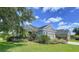 Charming home exterior with a well-manicured lawn and garden, creating a welcoming curb appeal at 16848 Rosedown Gln, Parrish, FL 34219