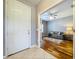 Welcoming foyer leading to a living area with hardwood floors and a gray sofa at 16848 Rosedown Gln, Parrish, FL 34219
