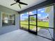 Screened-in lanai offering seamless indoor-outdoor living, with picturesque views of the grassy backyard at 16848 Rosedown Gln, Parrish, FL 34219