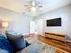 Comfortable living room featuring modern furnishings, wood floors, and a ceiling fan at 16848 Rosedown Gln, Parrish, FL 34219