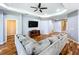 Expansive living room featuring a large sectional sofa and recessed lighting at 16848 Rosedown Gln, Parrish, FL 34219