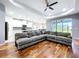 Expansive living area with hardwood floors, leading to a well-equipped kitchen and dining space at 16848 Rosedown Gln, Parrish, FL 34219