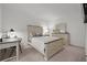 Cozy bedroom with a queen-sized bed, desk, and dresser, offering a serene and comfortable retreat at 17902 Gawthrop Dr # 107, Bradenton, FL 34211