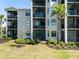 Charming outdoor patio with cozy seating, perfect for relaxing and enjoying the beautiful golf course views at 17902 Gawthrop Dr # 107, Bradenton, FL 34211