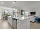 Kitchen with island and barstools overlooks a dining area with great outdoor views at 17902 Gawthrop Dr # 107, Bradenton, FL 34211