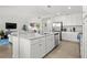 Open concept floor plan with a kitchen island that offers seating and additional counter space at 17902 Gawthrop Dr # 107, Bradenton, FL 34211