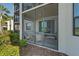 A cozy outdoor lanai with beautiful landscaping around the building at 17902 Gawthrop Dr # 107, Bradenton, FL 34211