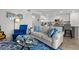 Inviting living room featuring an open floor plan to the kitchen, with blue accents and comfortable seating at 17902 Gawthrop Dr # 107, Bradenton, FL 34211