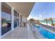 Expansive balcony with seating, offering views of the pool, beach, and ocean at 1800 Benjamin Franklin Dr # B310, Sarasota, FL 34236
