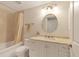 Cozy bathroom featuring a shower-tub combo, a neutral color palette, and a marble vanity at 1800 Benjamin Franklin Dr # B310, Sarasota, FL 34236