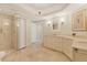 This spacious bathroom features dual sinks, a glass-enclosed shower, and lots of natural light at 1800 Benjamin Franklin Dr # B310, Sarasota, FL 34236