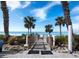Charming beach access point with palm trees offering a direct path to pristine sands at 1800 Benjamin Franklin Dr # B310, Sarasota, FL 34236