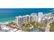 Beautiful beachfront condominiums featuring lush landscaping and pristine white sand beaches at 1800 Benjamin Franklin Dr # B310, Sarasota, FL 34236