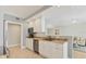 Bright kitchen with stainless steel appliances, granite countertops, and convenient breakfast bar at 1800 Benjamin Franklin Dr # B310, Sarasota, FL 34236