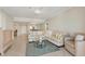 Spacious living room with comfortable seating and access to dining room at 1800 Benjamin Franklin Dr # B310, Sarasota, FL 34236