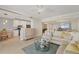 Open floor plan living room, dining room, and kitchen at 1800 Benjamin Franklin Dr # B310, Sarasota, FL 34236