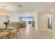 Open floor plan living room with tile floors and views of the ocean at 1800 Benjamin Franklin Dr # B310, Sarasota, FL 34236