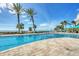 Community pool with no-diving markings and a beautiful beach and ocean view at 1800 Benjamin Franklin Dr # B310, Sarasota, FL 34236