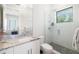 Modern bathroom with granite counters, sleek fixtures, and a glass-enclosed shower, creating a spa-like retreat at 1842 Kenilworth St, Sarasota, FL 34231