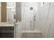 Luxurious bathroom with a spacious glass shower and elegant marble tiling at 1842 Kenilworth St, Sarasota, FL 34231