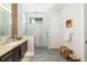 Bathroom featuring a double vanity, glass shower, and modern design elements at 1842 Kenilworth St, Sarasota, FL 34231