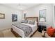 Bright bedroom with a ceiling fan, stylish bedding, and modern furnishings, creating a comfortable and inviting space at 1842 Kenilworth St, Sarasota, FL 34231