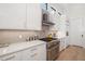Contemporary kitchen featuring stainless appliances and white cabinetry at 1842 Kenilworth St, Sarasota, FL 34231
