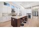 Bright open kitchen featuring a large island with seating and stainless appliances at 1842 Kenilworth St, Sarasota, FL 34231