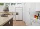 Contemporary kitchen featuring sleek white cabinets, stainless steel appliances, and modern design at 1842 Kenilworth St, Sarasota, FL 34231