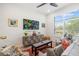 Cozy living area with modern decor, a patterned cabinet, and bright windows at 1842 Kenilworth St, Sarasota, FL 34231