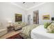 Spacious bedroom with a sitting area, plush sofa, and a mix of textures, offering a relaxing space at 1842 Kenilworth St, Sarasota, FL 34231