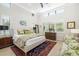 Bright bedroom featuring high ceilings, large windows, neutral tones, and elegant furnishings, creating a serene retreat at 1842 Kenilworth St, Sarasota, FL 34231
