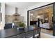Outdoor dining area overlooking gourmet kitchen and formal living room is perfect for entertaining guests at 1842 Kenilworth St, Sarasota, FL 34231