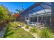Tropical landscaping surrounds an outdoor living area with a pool, spa, and screened-in lanai at 1842 Kenilworth St, Sarasota, FL 34231