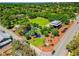 Stunning aerial view of a park featuring a playground, pavilion, and lush landscaping, perfect for community gatherings at 1907 4Th W St, Palmetto, FL 34221