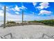 Backyard lounge area with coastal views, decorative rocks and lush plants at 1907 4Th W St, Palmetto, FL 34221