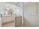 Bathroom features double vanity and glass-enclosed shower with decorative tile at 1907 4Th W St, Palmetto, FL 34221
